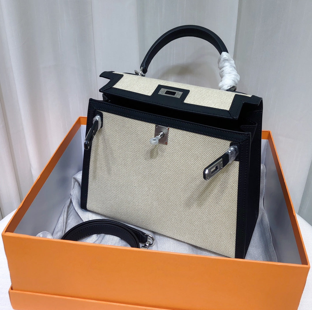 Top Selling Kelly 25 Bag With Outside Stitching, Made Of Textured Canvas & Soft Swift Leather Patchwork, Classic Black Silver Hardware Combination, Stunning Mixed Material Texture Dimensions: Length 25 * Width 10 * Height 18cm
