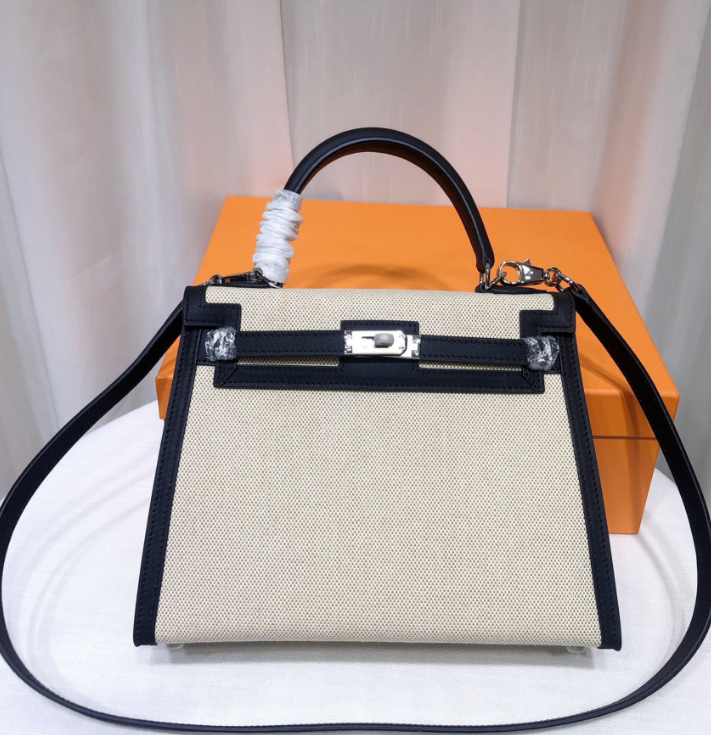 Top Selling Kelly 25 Bag With Outside Stitching, Made Of Textured Canvas & Soft Swift Leather Patchwork, Classic Black Silver Hardware Combination, Stunning Mixed Material Texture Dimensions: Length 25 * Width 10 * Height 18cm