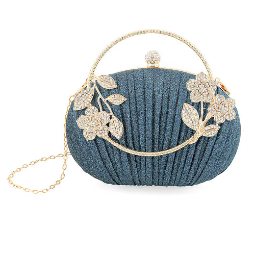 Crossbody bag/clutch with metal frame and crystal rhinestone embellishment.