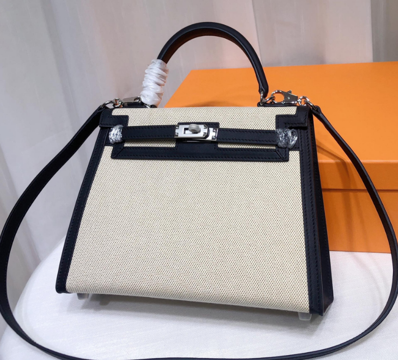 Top Selling Kelly 25 Bag With Outside Stitching, Made Of Textured Canvas & Soft Swift Leather Patchwork, Classic Black Silver Hardware Combination, Stunning Mixed Material Texture Dimensions: Length 25 * Width 10 * Height 18cm