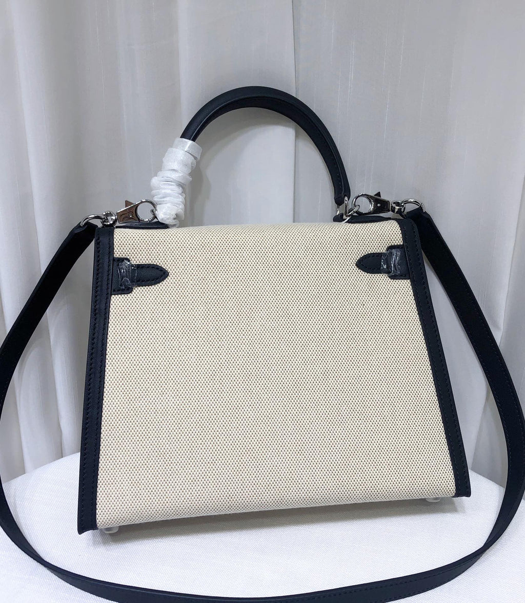 Top Selling Kelly 25 Bag With Outside Stitching, Made Of Textured Canvas & Soft Swift Leather Patchwork, Classic Black Silver Hardware Combination, Stunning Mixed Material Texture Dimensions: Length 25 * Width 10 * Height 18cm